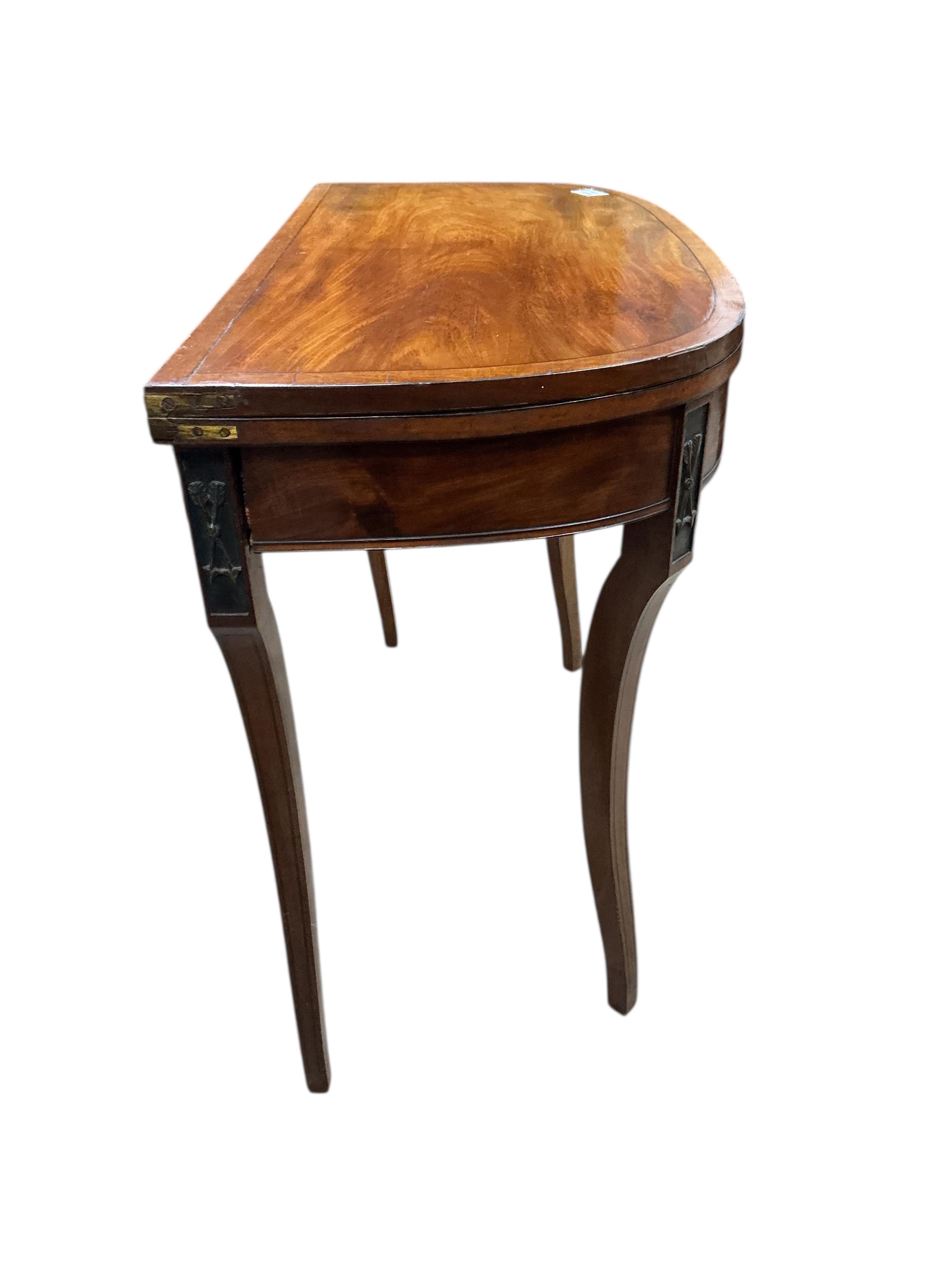 A Regency mahogany D shaped folding card table, width 92cm, depth 45cm, height 74cm